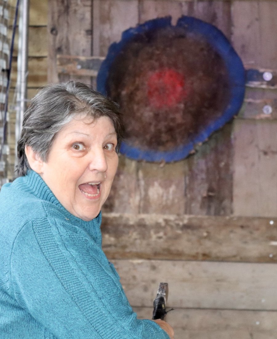 Guest enjoying axe throwing at No Name Bar and Games