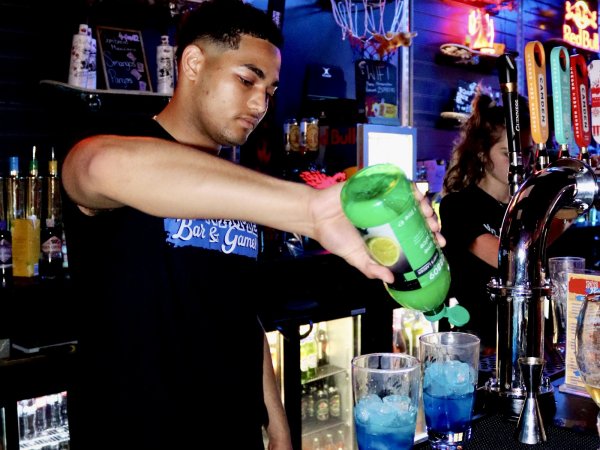 Bartender making 2 for £12 cocktails at No name bar and games
