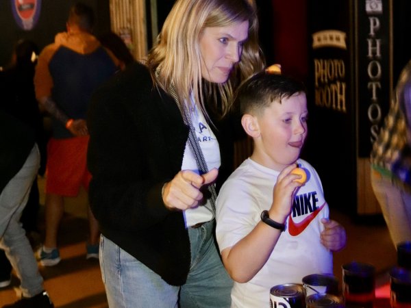Mum and son playing beer pong during half term Colchester
