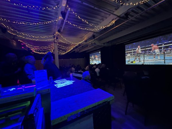 people watching boxing on 2 x 200" projectors at no name bar and games Colchester