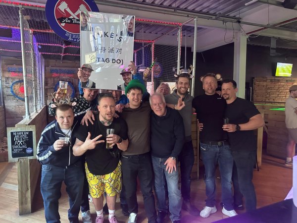 Group of men on a stag do at no name bar and games